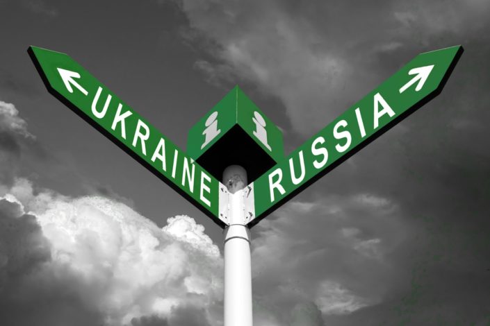 A pathfinding sign with arrows pointing the direction to Ukraine and Russia